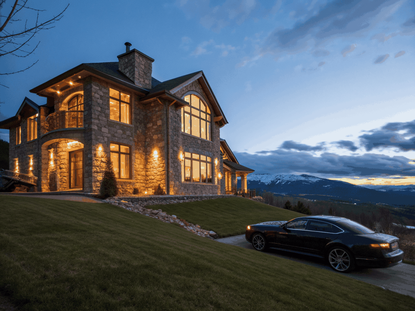 evening view of an upscale Milton residence with architectural lighting