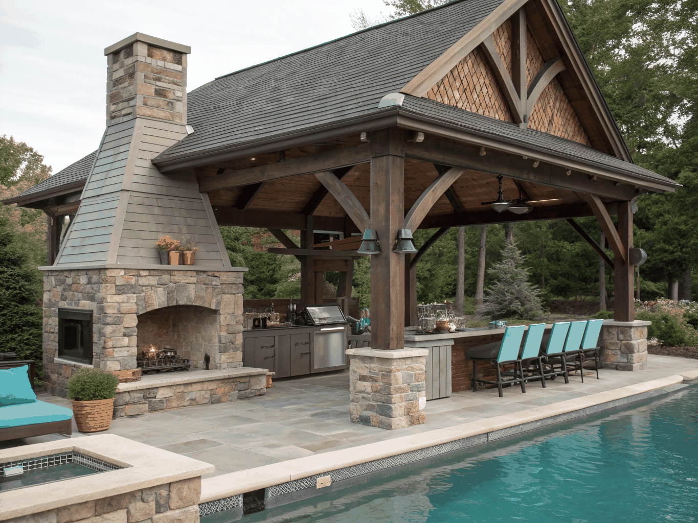 Representative covered outdoor living pavilion with fireplace and exterior kitchen